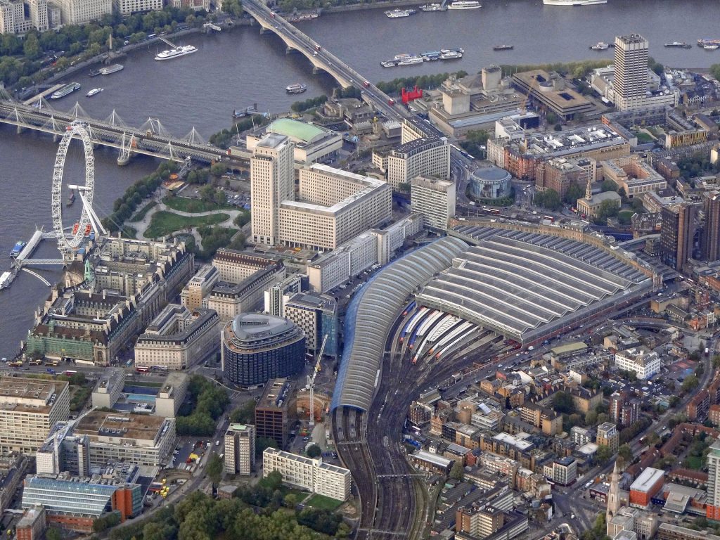 Aerial view from the south, showing Waterloo station, Waterloo, Hungerford Bridges and the London Eye